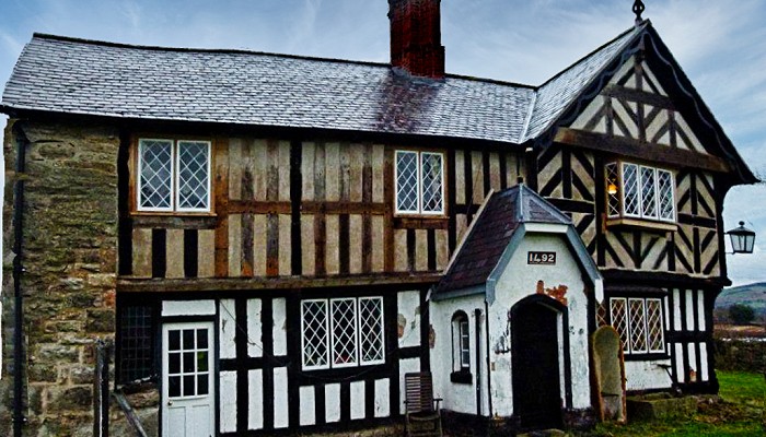 Black and white timber frame house.