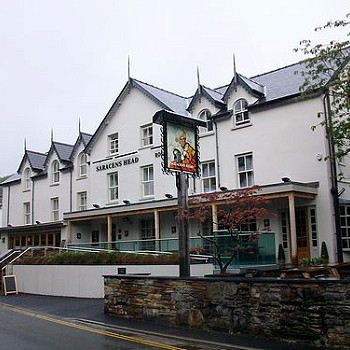 Large 3 storey white building used as an inn