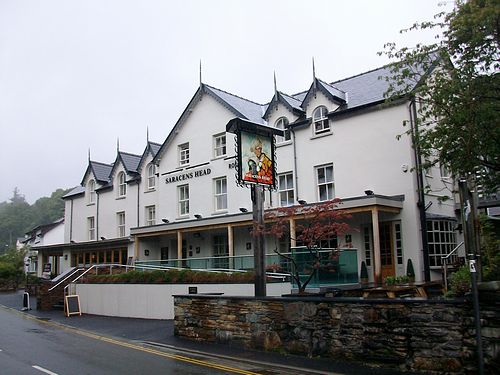 Large 3 storey white building used as an inn