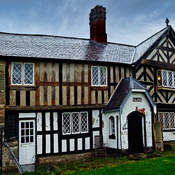Black and white timber frame house.