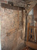 Internal stone wall with exposed timbers